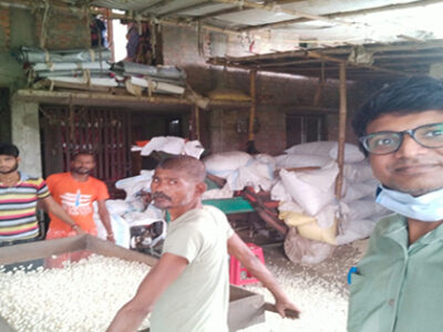 Traditional Makhana processing – showing fox nuts being roasted, popped, and sorted manually by farmers
